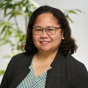 A headshot of Nerriza Bautista smiling