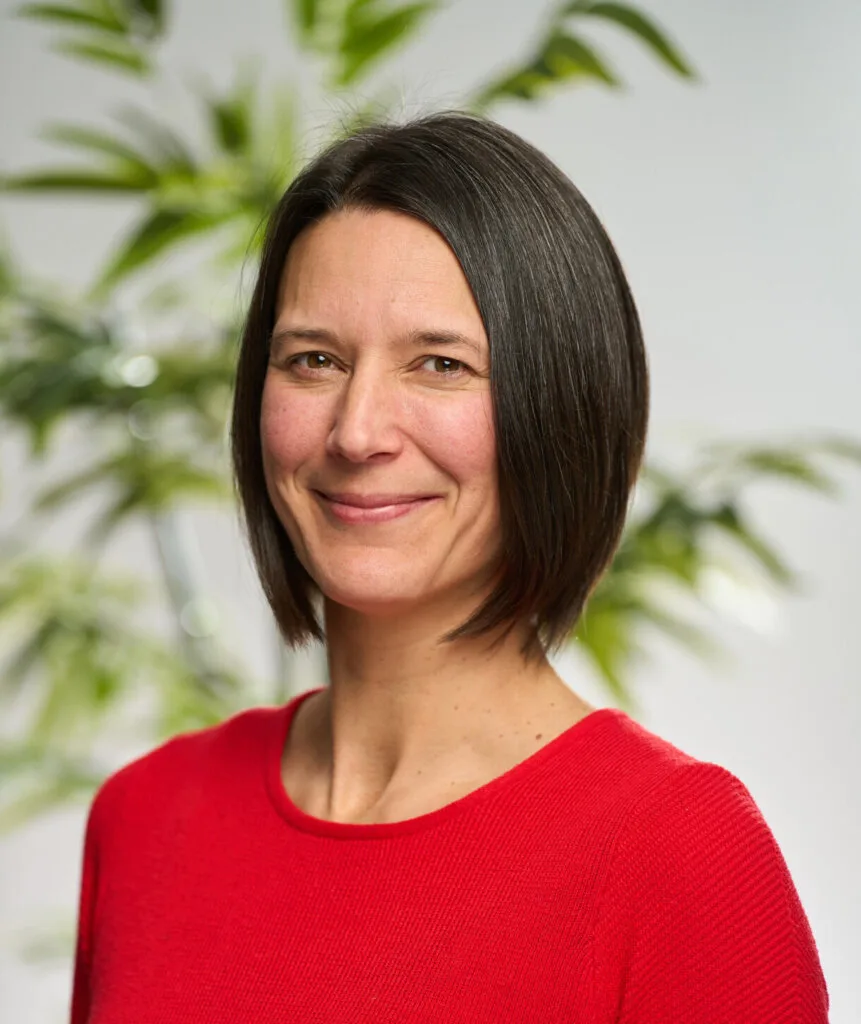 A headshot of Rebecca Atkinson smiling
