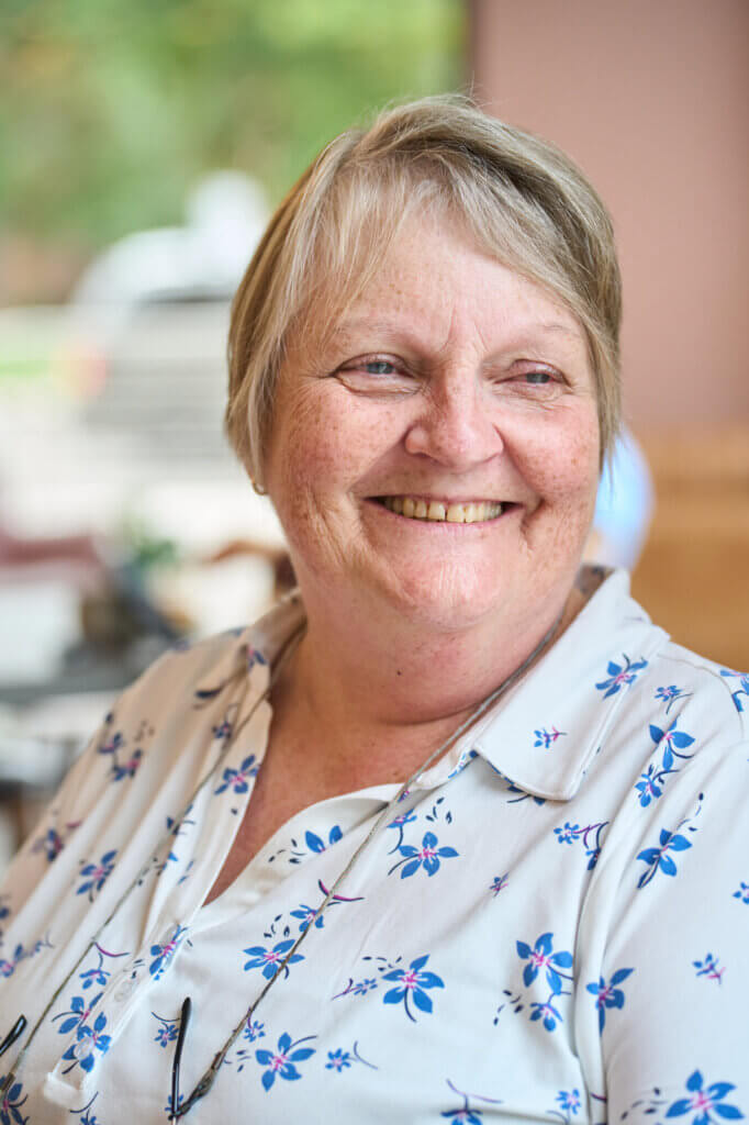 Bev McIntyre smiling at her weekly care partner meeting